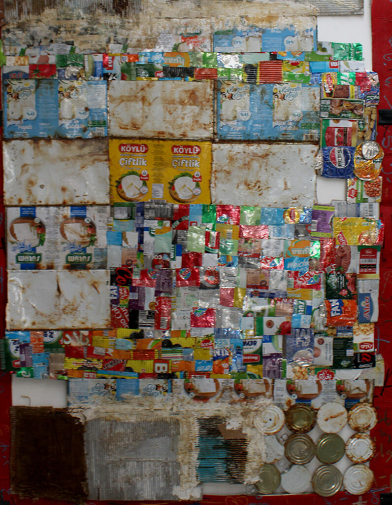 Wall of Tin (180 × 150 cm – Installation and Print)..This wall is made from old cans